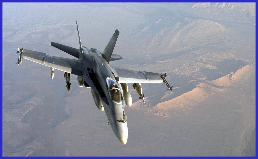 A Navy F/A-18 Hornet, equipped with two AIM-9L Sidewinder missiles on its wingtips and two GBU-16 1,000-pound Paveway II Laser Guided Bombs, patrols the Afghan skies to support Operation Enduring Freedom. This operation was initiated by President George W. Bush after the September 11, 2001, terrorist attacks on the New York World Trade Center and the Pentagon.