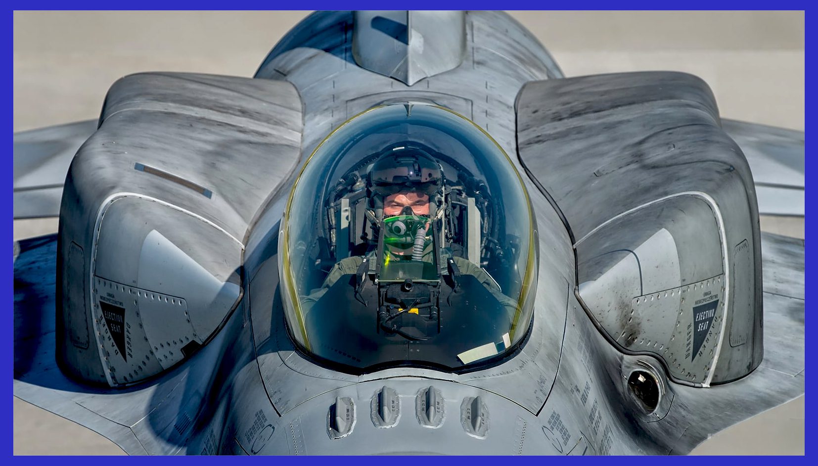 Photo Credit: Hesja Air-Art Photography / An air-to-air, close-up image of an F-16C/D cockpit and Conformal Fuel Tank design.