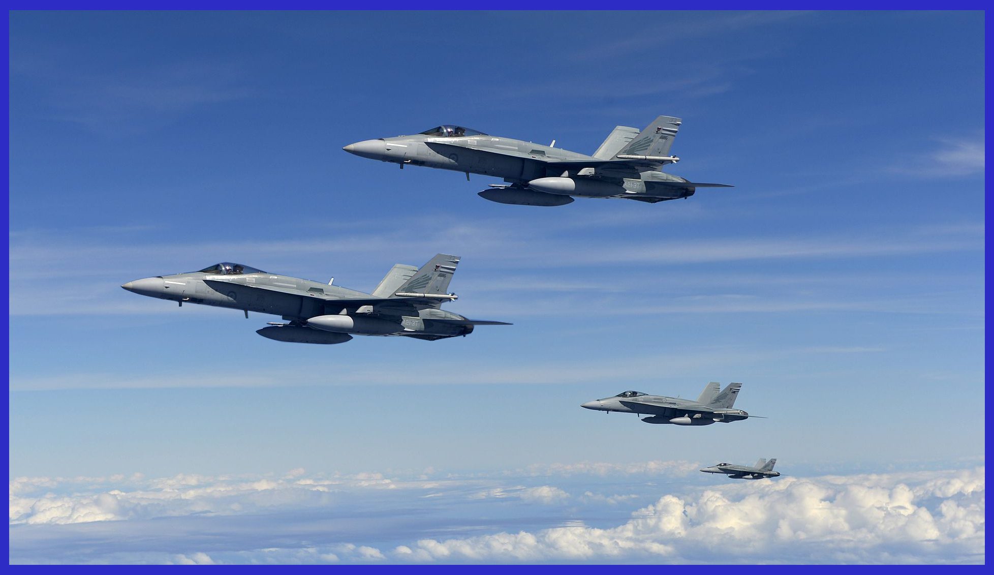 Photo Credit: RAAF / Four RAAF F/A-18E Hornets in Formation, Armed with Mighty Advanced SRAAMs on Their Wing Tips