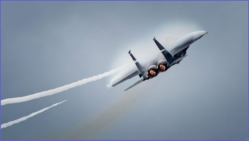 Vortices are created at the tips and leading-edge extensions of an F-15.